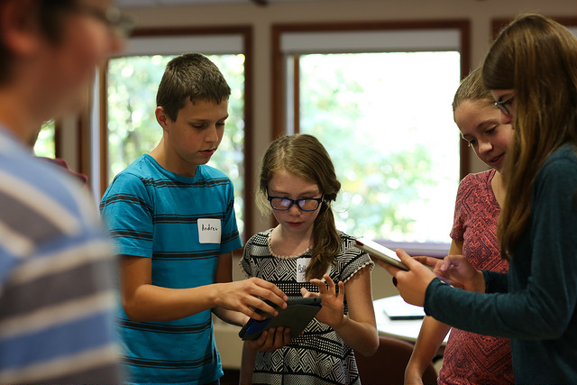 kids playing games on mobile devices